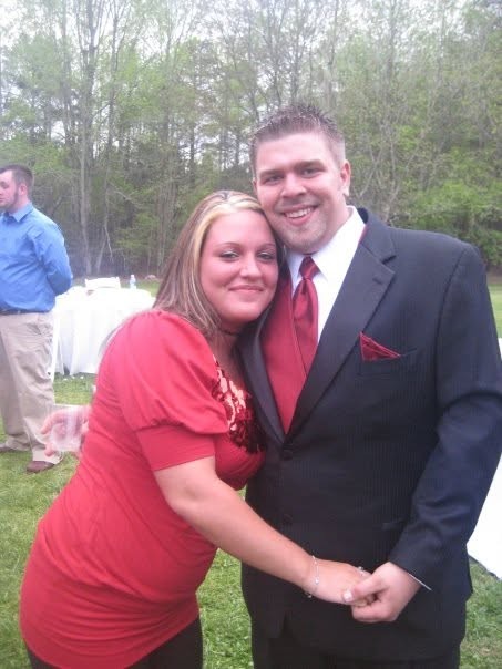 Nate beaming in his suit, arm around a loved one.