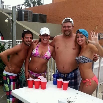 All smiles poolside with friends on a sunny getaway.